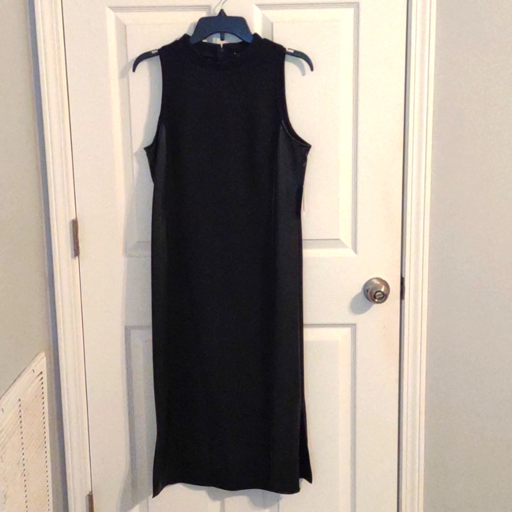 Suede like material with leather trim down both sides, small slit on both sides